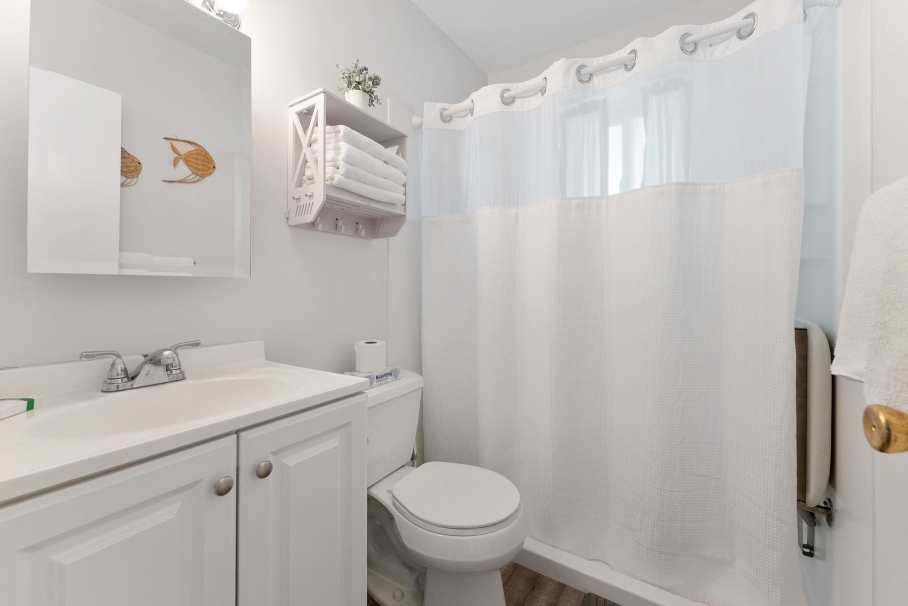Bathroom with white vanity and shower curtain