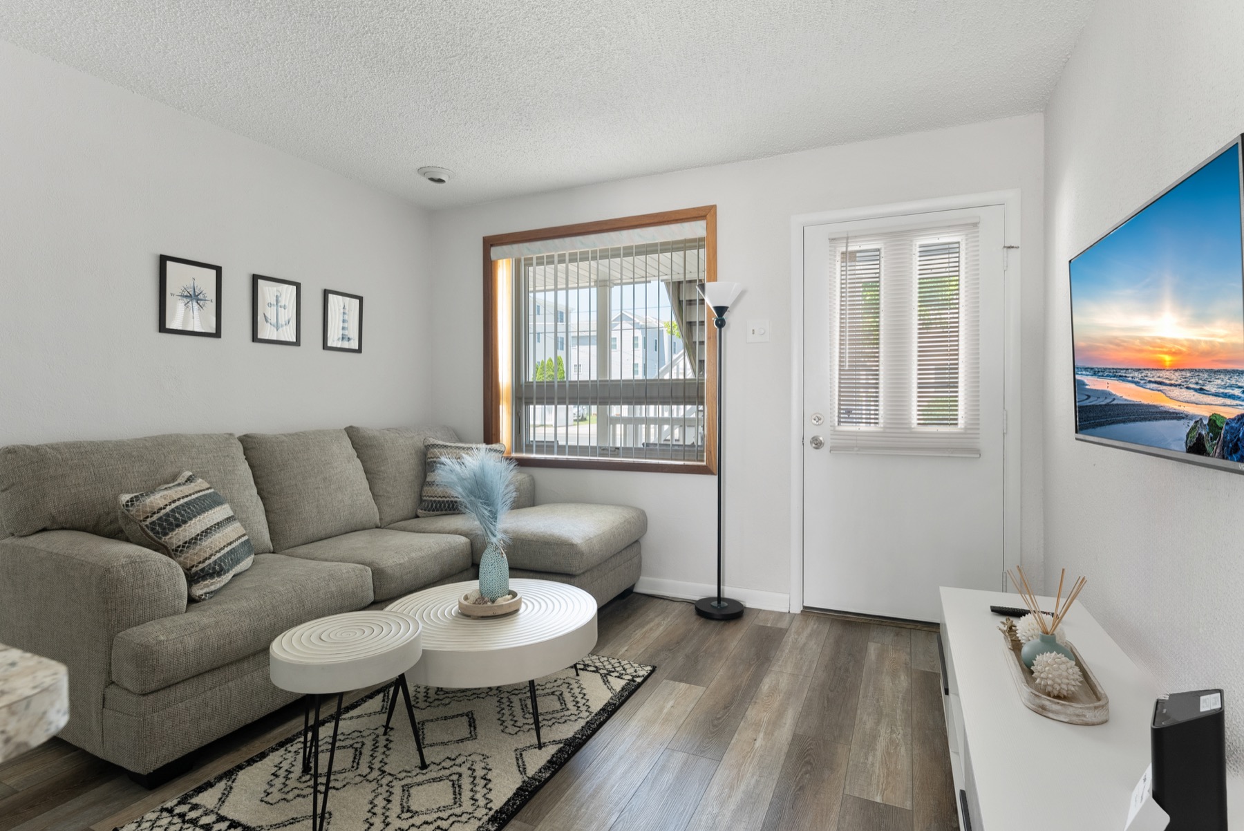 Alternate living room angle with sofa and dining counter